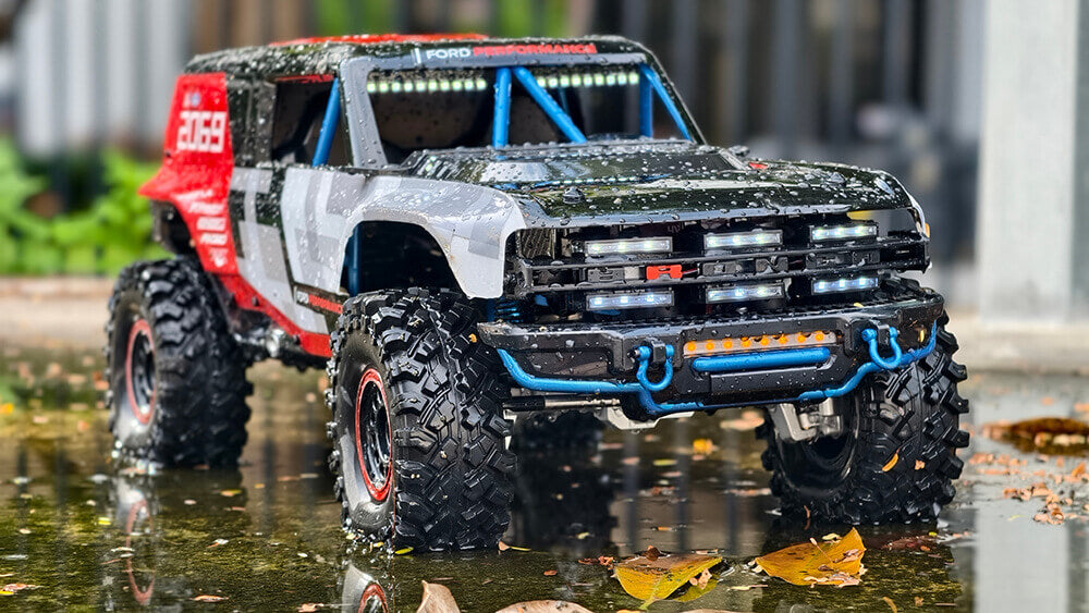 Action shot of MJX Hyper Go H8P Ford Bronco Baja 1000R RC truck